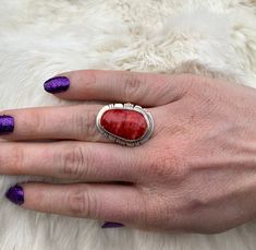 A gorgeous marble Red Spiney Ring set in beautiful Sterling Silver. Artisan Red Jewelry For Anniversary, Unique Red Ruby Ring Collectible, Unique Red Ruby Ring For Collectors, Collectible Red Gemstone Rings, Red Oval Natural Stone Jewelry, Red Oval Rings With Natural Stones, Red Oval Jewelry With Natural Stones, Coral Cabochon Jewelry For Gift, Artisan Red Sterling Silver Rings