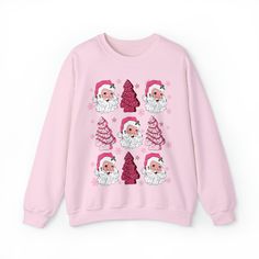 Christmas Tree Cake Sweatshirt, Pink Santa Sweatshirt, Funny Holiday Pullover, Retro Hippy Santa Shirt, Preppy Christmas Sweatshirt 💫Ideal for any situation, a unisex heavy blend crewneck sweatshirt is pure comfort. 💫 Made with a medium-heavy fabric blend of 50% cotton and 50% polyester, this sweatshirt feels cozy and is the perfect choice for those colder months. 💫 Made using 100% ethically grown US cotton. Gildan is also a proud member of the US Cotton Trust Protocol ensuring ethical and su Cute Holiday Crew Neck Sweatshirt, Cute Crew Neck Sweatshirt For Holiday, Casual Christmas Sweatshirt With Cartoon Print, Christmas Long Sleeve Tops With Cartoon Print, Casual Pink Christmas Sweater, Pink Tops As Winter Gifts, Holiday Crew Neck Top With Cartoon Print, Pink Long Sleeve Christmas Sweater, Pink Crew Neck Top For Christmas