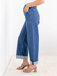 We are loving the denim updates that we are seeing this season and these new arrivals from Free People show off some of our favorite details all in one. The unique button waist detail adds a unique and casual twist on a traditional waistband. A wider leg silhouette features a cuffed accent that can be uncuffed for versatility, allowing this look to be styled in a variety of ways this season. Free People Wider leg silhouette Cuffed hemline Unique button waist accent 100% Cotton Rise: 10.5" Inseam: 26" cuffed | 31" uncuffed.. Leg opening: 17" Everyday High Rise Cargo Jeans For Spring, Spring Dark Wash Flare Jeans With Patch Pockets, Spring Flare Jeans With Patch Pockets In Dark Wash, Dark Wash Bottoms For Everyday Fall Wear, Spring Mid-rise Everyday Cargo Jeans, Everyday Spring High Rise Cargo Jeans, High Rise Cargo Jeans For Everyday Spring Wear, Mid-rise Cargo Jeans For Everyday Spring, Spring Everyday Cargo Jeans With Patch Pockets