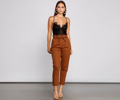 Keep on trend with tapered pants that are perfect to take you from day to night! The pants feature a high rise paperbag waist. a tie-waist belt. a double row slide hook closure. hidden zipper. slant pockets. faux back pockets. and a tapered leg. The pants are composed of a twill knit fabric that offers a form hugging fit with minimal stretch. Complete look with a bodysuit and mules.Fit & Features High rise paperbag waist Removable tie-waist belt. belt loops Double-row metal slide hook closure. h Paperbag Pants, Metal Slide, Tapered Pants, Keep On, Trendy Dresses, Waist Belt, Tapered Legs, Fashion Pants, Two Piece Pant Set