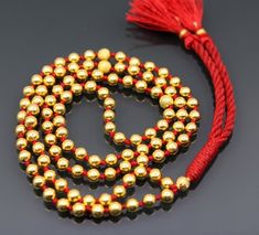 A Japamala or mala is a string of prayer beads commonly used in Hinduism, Jainism, Sikhism, Buddhism and Shintō for the spiritual practice known in Sanskrit as japa. The rosary is usually made from 108 beads, though other numbers are also used. Malas are used for keeping count while reciting, chanting, or mentally repeating a mantra or the name or names of a Deity.20karat gold beads strung in a cotton thread with knot within each gold beads to make this necklace.Metal-20karat yellow gold.Type- N Gold Mala With Round Beads For Healing, Gold Bohemian Mala With Round Beads, Gold Mala With 8mm Beads For Meditation, Adjustable Gold Beaded Mala, Gold Hand-strung Mala With Round Beads, Foot Bracelet, Meditation Mantras, Dance Jewelry, 108 Bead