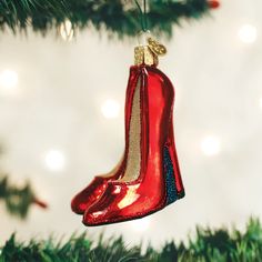 a red shoe ornament hanging from a christmas tree