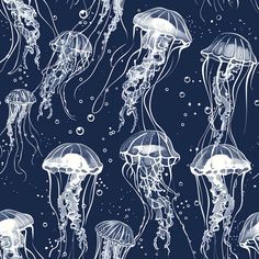 a group of jellyfish floating in the ocean on a dark blue background with bubbles