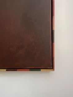 a painting on the wall with brown paint