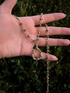 Handmade necklace in gold-toned tarnish resistant copper wire and green beads. Alternating green and gold beads end in a handmade swirling pendant. 17 1/2 inches, adjustable.  Made with 20 gauge wire. While generally sturdy, as with all wire jewelry, there is potential for the wire to be bent, so please handle with care. Green Copper Hand Wrapped Necklaces, Green Hand Wrapped Copper Necklace, Gold Beaded Necklaces For May Birthstone, Green Necklaces With Gold Beads For Jewelry Making, Gold Wire Wrapped Metal Beaded Necklaces, Gold Wire Wrapped Beaded Necklaces, Green Bohemian Copper Wire Necklace, Gold Wire Wrapped Metal Beaded Necklace, Gold Metal Wire Wrapped Beaded Necklace