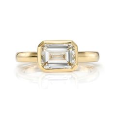 1.58ct J/VVS2 GIA certified emerald cut diamond bezel set in a handcrafted 18K yellow gold mounting. Octagon Yellow Gold Emerald Ring With Vvs Clarity, Gia Certified Rectangular Yellow Gold Diamond Ring, Classic Gold Square Cut Emerald Ring, Gold Emerald Ring With Baguette Cut Bezel Setting, Rectangular Gold Emerald Ring With Bezel Setting, Gold Rectangular Diamond Ring With Single Diamond, Gold Gia Certified Diamond Ring With Asscher Cut, Gold Diamond Ring With Single Rectangular Diamond, Gold Diamond Ring With Rectangular Shape