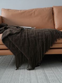 a couch with a blanket on top of it