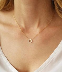 We know you will love the simplicity of our 14k gold filled dainty circle necklace.  This gold piece is as stunning as it is versatile. Wear this piece on its own for your daytime look or layer it with other gold necklaces for a statement-making evening look.  This necklace features a delicate 14k gold filled link chain and a simple open circle pendant design to create a look you will want to wear time and time again. Necklace on model measures 16 inches choose your length from the drop down menu (15" - 18") Circle pendant measures 8mm. Photo #5 - Sterling silver necklace (choose your choice from the drop down menu)  We have the right circle earrings for you to match this beautiful necklace -  https://www.etsy.com/il-en/listing/466244747 This necklace is available also with 14K Gold filled Minimalist Gold Open Circle Necklace, Gold Minimalist Open Circle Necklace, Simple Tiny Charm Necklace, Dainty Circle Necklace With Adjustable Chain, Minimalist 14k Gold Filled Round Necklace, Delicate Chain Open Circle Necklace, Simple 14k Gold-filled Necklace, Simple Charm Necklace With Round Pendant And Delicate Chain, Minimalist Gold Circle Charm Necklace