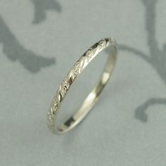 a wedding ring with an intricate design on it