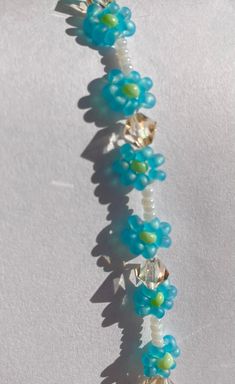 Cute beaded angel blue daisy bracelet with sparkling beads and pearl white spacers in between Angel Blue, Daisy Bracelet, Blue Daisy, Daisy Chain, Tampa Fl, Beaded Choker, Pearl White, Tampa, Jewelry Bracelets