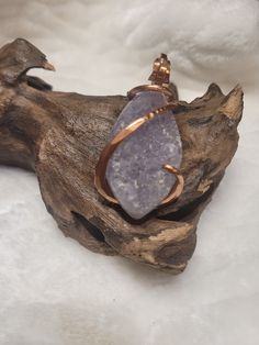 Natural Raw Chunky Amethyst Stone Pendant ♥ Increases nobility ♥ Spiritual awareness ♥ Psychic abilities ♥ Inner peace and healing ♥ Healing of body, mind & soul ♥ Positive transformation ♥ Meditation ♥ Balance ♥ Relieves stress ♥ CommunicationDetails: Handcrafted Item using Copper with Cold Forge Wire Wrap technique. Material: Natural Amethyst, Copper Measures 2L" X 1" One Of A Kind - Ships within 1-3 Days Securely Packaged. Your Choice Of Matching 18" Chain or Leather Cord. UNISEX ITEM Unique Crystal Necklaces With Large Stone For Healing, Lavender Natural Stones Jewelry For Meditation, Spiritual Purple Necklace With Large Stone, Spiritual Crystal Necklace With Large Stone, Handmade Amethyst Jewelry For Meditation, Holistic Amethyst Gemstone Jewelry, Lavender Spiritual Pendant Necklace, Spiritual Healing Crystal Pendant, Healing Spiritual Crystal Pendant