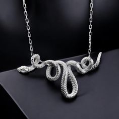 🐍 Unleash Your Wild Side with the Snake Silver Necklace! Looking for a bold statement piece that stands out? This handmade sterling silver snake pendant is perfect for animal lovers 🦎 and anyone with a unique sense of style. 💡 Why You'll Love It: Crafted with attention to detail, the intricate snake design symbolizes power, transformation, and protection. Its sleek and timeless design makes it ideal for daily wear or special occasions. Whether you're shopping for yourself or a gift 🎁 for him Silver Snake Necklace, Snake Necklace Silver, Lover Jewelry, Snake Pendant, Snake Necklace, Snake Design, Men's Necklace, Necklace Handmade, Animal Lovers