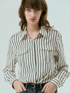 Editor's NotesSoft and drapery, this lightweight shirt features classic collar design and buttoned front silhouette. Striped pattern and gold button detail add to the chic, sophisticated mood. - Sheer silky fabric- Natural, standard silhouette- Casual stripe pattern throughout- Chest pockets and epaulette detail- Versatile styling and easy layeringMeasurements(in.)Size One Size(XS-M)- Shoulder: 16.93 in - Bust: 20.47 in - Sleeve length: 23.62 in - Hem: 21.26 in - Length: Elegant Striped Button-up Tops, Spring Vertical Stripes Button-up Blouse, Vertical Stripes Button-up Tops For Daywear, Pinstripe Button-up Blouse With Striped Collar, Silky Shirt, Pinstripe Long-sleeved Shirt With Button Closure, Casual Stripes, Gold Buttons, Collar Designs