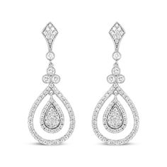 Let the sparkle of diamonds enhance your every look! Glimmering prong-set round diamonds adorn polished 18k white gold, giving you a stunning look of sophistication. These diamonds total 1 1/4 cttw with an approximate F-G Color and VS1-VS2 Clarity. The silhouette features an intricate upper dangle set with diamonds clusters above a single round diamond encases in a secure bezel setting with milgrain detail. Beginning the lower dangle is a trio of round white diamonds that signify the past, present, and future, which are also showcases in bezel settings with milgrain ornamentation. A cluster of round, prong-set diamonds form a teardrop silhouette haloed by additional round, prong-set diamonds. A metal framework prong-set with round diamonds adds a second halo to this centerpiece that captur Sparkling Diamond Bridal Earrings, Dazzling Dangle Diamond Earrings With Pave Setting, Diamond White Sparkling Chandelier Earrings, Classic White Gold Teardrop Earrings With Diamond Cut, Brilliant Cut Diamond Drop Earrings, White Gold Pear-shaped Diamond Chandelier Earrings, Formal White Gold Teardrop Earrings With Brilliant Cut, White Gold Diamond Chandelier Earrings Pear-shaped, Drop Diamond Earrings With Pave Setting