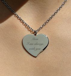 "Our engraved silver heart necklace is a great personalized gift for that special someone. The silver heart necklace can be custom engraved with names, dates or a message of love on both sides of the heart pendant. This high polished stainless steel pendant will never tarnish or fade or change color. Great gift for bridesmaids, flower girls, best friends, or the love of your life. Silver Teardrop Heart Necklace Dimensions: 1.25\" X 1\" Material: Stainless Steel Includes stainless steel chain How Personalized Stainless Steel Heart Necklace For Anniversary, Anniversary Stainless Steel Heart Pendant Necklace, Stainless Steel Heart Pendant Necklace For Anniversary, Personalized Stainless Steel Heart Necklace For Mother's Day, Mother's Day Stainless Steel Heart Pendant Necklace, Mother's Day Heart Pendant Necklace In Stainless Steel, Stainless Steel Heart Pendant Necklace For Mother's Day, Personalized Stainless Steel Heart Necklace, Mother's Day Engraved Stainless Steel Heart Necklace