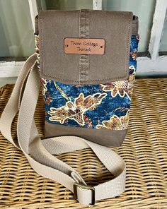 You will love using this crossbody bag for its eye-catching looks and compact size!   Perfect for when all you need is a phone, ID, a few credit cards, ear buds and lip balm. Constructed with up- cycled light brown twill and a casual floral print. Opening the flap's magnetic snap reveals an outer front compartment with  a card pocket that can each easily hold 3-4 cards. The pockets are made of  Faraday fabric that will keep your card information secure. The main compartment has one slip pocket a Adjustable Crossbody Phone Bag For Travel, Adjustable Strap Phone Bag For Everyday Use, Adjustable Crossbody Phone Bag For Everyday, Casual Crossbody Shoulder Bag For Personal Use, Adjustable Phone Bag With Cell Phone Pocket For Travel, Crossbody Shoulder Bag With Cell Phone Pocket As Gift, Gift Crossbody Shoulder Bag With Cell Phone Pocket, Casual Rectangular Phone Bag With Hidden Sleeve, Casual Mobile Phone Bag For Personal Use