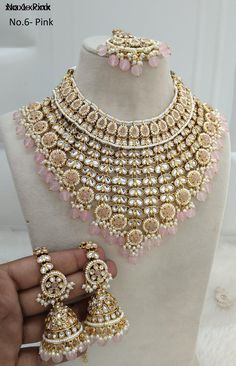 *Light Weight Gold Kundan Adjustable necklace set with earrings and tikka. *Studded with kundan stone. *Light Weight Gold kundan necklace. *Necklace width-  4.2 inches (included pearl drop) *Earrings Length- 2.5 inches(included pearl drop) *Earrings dome size- 1.1 inches Luxury Heavy Temple Jewelry Danglers, Pink Hand Set Bridal Earrings For Wedding, Pink Chandbali Bridal Set For Festive Occasions, Pink Jewelry For Reception And Festivals, Hand Set Pink Bridal Necklace For Wedding, Pink Bridal Sets With Stone Work For Festivals, Pink Hand Set Bridal Sets For Reception, Pink Necklace For Wedding And Festive Occasions, Pink Kundan Necklace Hand Set For Reception