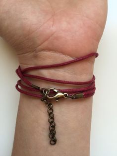 "BUY TWO GET A THIRD FOR FREE!! (please, don't add your free product to your shopping cart or you will be charged for it. Pick 1 product and leave the full name of it in the \"Note to enjoywelrydesign\" Box during checkout.)This is a waxed cotton Karma bracelet with an alloy metal bronze ring charm. What goes around, comes around. Wear your bracelet as a reminder, to keep the circle positive, peaceful and loving. The bracelet is adjustable and fits wrists from 51/2'' to 81/2\" (14cm to 22cm). Fi Bohemian Wrap Bracelet With Adjustable Length As Gift, Adjustable Bohemian Wrap Bracelet As Gift, Bohemian Jewelry With Adjustable Clasp For Gifts, Bohemian Jewelry With Adjustable Clasp As Gift, Bohemian Jewelry As A Gift With Adjustable Clasp, Bohemian Wrap Bracelet With Sliding Knot As Gift, Casual Adjustable Wrap Bracelet For Friendship, Spiritual Friendship Bracelets With Adjustable Cord As Gift, Spiritual Friendship Bracelets With Adjustable Cord