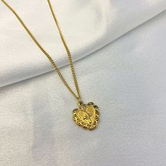 Embrace the beauty of faith and love with our Embroidered Heart Cross Necklace. This elegant piece showcases a beautifully embroidered cross nestled within a heart-shaped pendant, creating a heartfelt symbol of devotion and spirituality. With its intricate detailing and timeless design, it's the perfect accessory. Heart Cross Necklace, Embroidered Cross, Cross Heart, Golden Heart, Gold Cross Necklace, Embroidered Heart, Wood Crosses, Gold Cross, Hair Styling