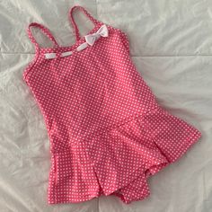 Lands’ End Skirted One-Piece Swimsuit. Pink With White Polka Dots & Ribbon Detail At Neckline. Adjustable Cross-Back Spaghetti Straps. Attached Pleated Style Skirt. Nylon/Spandex Blend. Never Worn. Nwot Skirt Bathing Suit Two Piece, One Piece Skirt Swimsuit, One Piece Swimsuit Skirt, Fitted Swimwear For Summer Playtime, Fitted Summer Swimwear For Playtime, Cute Fitted Ruffle Swimwear, Cute Fitted Ruffled Swimwear, Fitted Cotton Playful Swimwear, Playful Fitted Cotton Swimwear