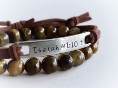 "Wear your favorite inspirational words on your wrist to remind yourself of what matters most to you every day. :) This unisex bracelet features the bible verse \"Isaiah 41:10\", hand stamped into non tarnish stainless steel, with a small cross at the end of the verse. The soft brown faux suede leather cord is adjustable and fits most wrist sizes. You can choose any other short verse you would like under \"personalization\", up to 10 letters works best with this design, but I can squeeze up to 1 Inspirational Personalized Faith Name Bracelet, Inspirational Handmade Name Bracelet For Everyday, Everyday Inspirational Handmade Name Bracelet, Inspirational Handmade Name Bracelet, Inspirational Custom Name Adjustable Bracelet, Inspirational Adjustable Bracelets For Personalized Gifts, Adjustable Personalized Brown Beaded Bracelets, Adjustable Brown Personalized Beaded Bracelets, Inspirational Engraved Adjustable Name Bracelet