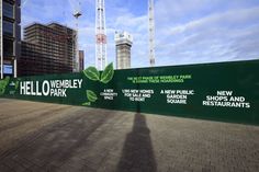 there is a large green sign on the side of this building that says hello - werbley park