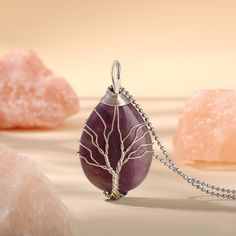 PLEASE NOTE: Our crystal stones are natural minerals and each crystal is unique. The internal ice cracks, pits, mineral points, and color differences of natural crystals are all formed naturally and are normal phenomena, which will not affect the efficacy, beauty and value of the crystal at all.This necklace is probably the most beautiful piece of jewelry you'll ever see. The intricate tree design weaved around the gorgeous purple crystal adds to this necklace's charm. Wear this magical piece ar Silver Gemstone Beads Crystals For Gift, Spiritual Agate Crystals For Gifts, Spiritual Agate Crystals As Gift, Natural Quartz Stones Crystals As Gift, Spiritual Gemstone Teardrop Pendant Crystal Necklaces, Spiritual Teardrop Gemstone Crystal Necklace, Gift Mineral Crystal Gemstone Beads, Rose Quartz Crystal Necklace As Gift, Gift Gemstone Beads Crystals