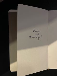 an open birthday card with writing on it