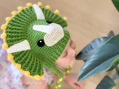 All dino-fans will enjoy wearing this zingy triceratops hat, a prehistoric pal that warms your heart with its presence. This pattern comes in 6 sizes ranging from babies to adults, so you can keep your ceratopsians warm and cozy. You can make this hat with earflaps and ties, or finish it as a beanie using your favorite colors. The instructions are written row-by-row in American crochet terms, along with crochet diagrams, step-by-step photos, and a conversion chart to UK terms. FORMAT & LANGUAGES Dinosaur Hat Crochet, Crochet Animal Hats, Dinosaur Hat, Needlework Shops, Hat Crochet Pattern, Crochet Dinosaur, Beginner Knitting Patterns, Front Post Double Crochet, Crochet Shop