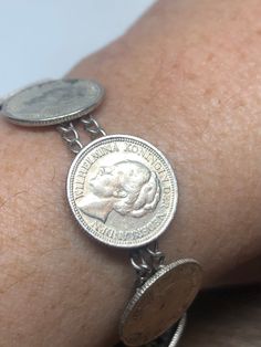 Vintage Coin Bracelet 925 Sterling Silver https://www.etsy.com/listing/776442181/vintage-coin-bracelet-925-sterling Antique Sterling Silver Round Bracelet Collectible, Vintage Sterling Silver Bracelet For Anniversary, Nickel Free, Nickel-free Vintage Sterling Silver Bracelet For Anniversary, Vintage Nickel-free Sterling Silver Bracelet For Anniversary, Antique Round Sterling Silver Collectible Bracelet, Antique Nickel-free Bracelets, Collectible Hallmarked Bracelets, Hallmarked Vintage Sterling Silver Bracelet, Vintage Sterling Silver Round Bracelet