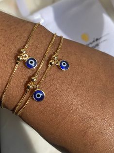 Gold Filled Evil Eye Bracelet Perfect as an accent bracelet or as a part of a stack with your other bracelets. 1mm dainty box Chain  6.5mm Evil Eye charm  The evil eye bracelet is adjustable while the herringbone bracelet has a lobster claw. Both are made from 18K Gold Filled Brazilian Gold. If you would like to purchase the herringbone alone, use the link below. https://www.etsy.com/uk/listing/914777068/18k-gold-filled-herringbone-bracelet? If you have any questions, please send me a message an Evil Eye Bracelet Gold, Herringbone Bracelet, Brazilian Gold, Turkish Eye, Gold Armband, Jewelry Accessories Ideas, Jewelry Lookbook, Eye Bracelet, Gold Bracelet Chain