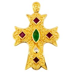 S.Georgios Byzantine Style Cross is handmade from solid 18 Karat Yellow Gold and has Granulation work and a beautiful mat finish. It features a Diamond total weight of 0.07 Carats, and Rubies, Emeralds, all total weight of 1.80 Carat. This art piece is made as an inspiration from the Byzantine Museum in Athens Greece. Please contact us for this design in white or rose gold or different stone selection. This Cross is outstanding in quality of workmanship and stone collection and is made in our wo Byzantine Cross, Byzantine Jewelry, Ruby Emerald, Antique Pendant, Magic Circle, Diamond Cross, Antique Necklace, Stone Collection, Modern Necklaces