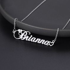 Personalized Birthstone Name Necklace is a custom made single nameplate necklace with the birthstone of your birth month. This is an appealingly beautiful necklace that gives a classy impression to the one who wears. Simply, you would love it. It provides an overall image of shining jewelry with a metallic finish. However, with the sparkling touch from our best quality graded crystal birthstone, this name necklace defines a whole new meaning to the collection of personalized name jewelry wears. Silver Nameplate Necklaces With Birthstone, Silver Birthstone Nameplate Necklace, Custom Name Silver Birthstone Nameplate Necklace, Silver Nameplate Birthstone Necklace As Gift, Silver Nameplate Birthstone Necklace, Custom Name Silver Birthstone Necklace For Birthday, Personalized Silver Name Necklace With Birthstone, Silver Name Necklace With Birthstone For Personalized Gift, Silver Birthstone Name Necklace For Personalized Gift