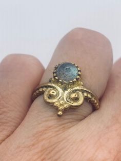 Huge long labradorite stone  Lovely vintage golden bronze setting Size 5.75 or 6  Our jeweler can custom re size this for a $20 fee.  All rings are shipped in a nice gift box.   Check out our over a THOUSAND great reviews Engraving is $4 per letter and is not always perfect depending on the piece. It can take a few days if the jeweler is busy. This is payable to Paypal Judithsltd@gmail.com Yellow Gold Brass Moonstone Ring For Gift, Spiritual Bronze Jewelry For Anniversary, Bronze Hand Forged Ring For Gift, Antique Bronze Jewelry For Anniversary, Antique Handmade Rings Perfect As Gifts, Bronze Jewelry With Antique Finish For Anniversary, Gold Labradorite Rings For Anniversary, Antique Handmade Rings As Gifts, Hand Forged Bronze Rings For Gift