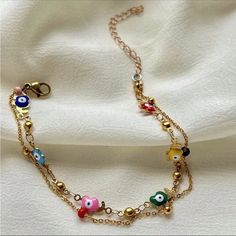 2 Bracelets In 1 For A Layered Look One Gold Plated Chain Link Bracelet & 1 Multi Candy Colored Camel Charm Bracelet Green, Red, Yellow, Purple, Blue, Green And Pink Colored Evil Eye With Gold Camel Charm Detailing Clasp Closure So Gorgeous & Chic Most Beautiful Gift Around 8.66 Inch & 2.36 Inch Extended Chain New. Perfect Condition Valentine’s Day Love Gift Colorful Rainbow Multicolor Copper Trendy Gorjana White Gold Silver Metallic 14k Adinas Jewels Swarovski Yellow Gold Black Pupil Diamond Ac Adjustable Delicate Chain Bracelets For Summer, Adjustable Chain Bracelets For Summer, Adjustable Delicate Chain Bracelet For Summer, Gold Chain Bracelet For Summer, Summer Gold Chain Bracelet, Adjustable Chain Bracelet Summer Gift, Adjustable Chain Bracelet As Summer Gift, Adjustable Chain Bracelet For Summer Gift, Gold Chain Bracelets For Beach