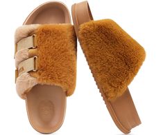 a pair of brown slippers with fur on the bottom and one foot in the middle