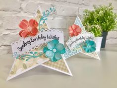 two star shaped cards with flowers on them