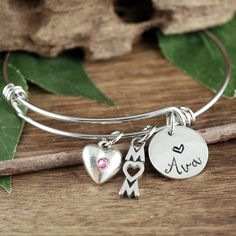 Take a LOOK at our Website: ANNIEREH.com Looking for that perfect gift for Mom? See our personalized Custom Mom Bracelet with her children's Names. Details for Bracelet: * Stainless Steel Bangle * Pewter Heart with Birthstone for MOM * MOM Pendant * ONE Name added to represent each Child. More names can be added during check out. (price will adjust automatically) How to order: 1. Select the number of names (let us know the name in the note to seller box) at check out Thank you for shopping! Anni Engraved Adjustable Charm Bracelet As Gift, Adjustable Metal Bracelets For Valentine's Day, Hypoallergenic Silver Friendship Bracelets For Mother's Day, Adjustable Bracelet Jewelry For Mother's Day, Adjustable Engraved Charm Bracelet As Gift, Adjustable Bangle Bracelets As Birthday Gift, Adjustable Bangle Bracelet For Personalized Gift, Stainless Steel Bangle Beaded Bracelets For Gift, Adjustable Metal Jewelry For Personalized Gifts