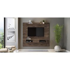 a living room with a large tv mounted to the side of it's wall