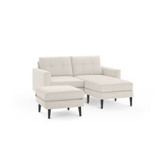 a white sectional couch and footstool on a white background