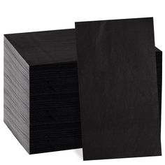 black paper napkins stacked on top of each other