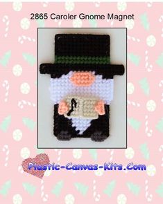 a small crocheted christmas ornament with a man in a top hat