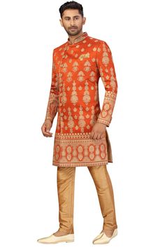 Product Features: Top Color: Rust Orange Bottom Color: Gold Work: Embroidery Top Fabric: Art Silk Bottom Fabric: Art Silk Pack Of: 1 Sherwani and Aligarh Pant Occasion: Partywear Disclaimer: There will be slight difference in digital to actual image Traditional Festive Dola Silk Sets, Festive Traditional Dola Silk Sets, Festive Unstitched Suit With Intricate Embroidery For Diwali, Multicolor Embroidered Sherwani With Zari Work For Festivals, Festive Traditional Wear With Multicolor Embroidery, Festive Multicolor Embroidered Sherwani With Zari Work, Traditional Salwar Kameez With Zari Work For Eid, Transitional Salwar Kameez For Traditional Ceremonies, Transitional Season Salwar Kameez For Traditional Ceremonies