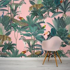 a wallpapered room with pink and green tropical leaves, leopards and other animals