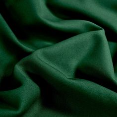 a close up view of a green fabric