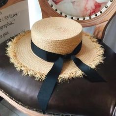 A Bohemian chic summer beach Raffia hat with a black ribbon, that is sure to make you look like the girl next door. A sun hat by Luna & Dolphin, this has a casual European and American style and has a simple yet classic look. A hat that is going to be your travel companion, owing to its versatile look.SpecificationsItem Type: Sun HatsMaterial: StrawDepartment Name: AdultGender: WomenStyle: CasualPattern Type: SolidModel Number: HAT0002Brand Name: GeraldBlackmain material: raffiaribbon material: White Ribbon Bow, The Girl Next Door, Black And White Ribbon, Raffia Hat, Bow Flats, White Ribbon, Girl Next Door, Black Ribbon, Bohemian Chic