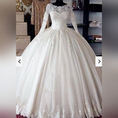 a white wedding dress on display in a store