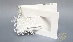 a close up of a white card on a table