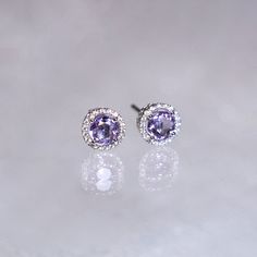 "These stylish earrings have a stunning bright color and the Amethyst is surrounded by a halo of shimmering diamonds. Perfect as a gift for yourself, your girlfriend or wife, or your mother. Features * Made to Order. * Metal: 925 Sterling Silver * Custom Color: Silver, Gold, Rose Gold * Main Stone: Amethyst, 5mm dia Round Shape, 2pcs * Side Stone: Cubic Zirconia Amethyst Ring: * Halo Ring: https://etsy.me/32kkc68 * Bypassing: https://etsy.me/32u2NIF Be sure to hit \"favorite\" on the right so it Purple Halo Jewelry As A Gift, Gift Amethyst Jewelry With Halo Design, Purple Gemstones With Halo Setting, Fine Jewelry Lavender Earrings As Gift, Purple Cubic Zirconia Round Earrings, Lavender Halo Setting Jewelry Gift, Purple Birthstone Earrings Fine Jewelry, Birthstone Engagement Rings, Halo Diamond Earrings