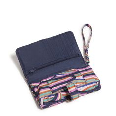 Combining sleek design with practical functionality, this wristlet keeps your phone and essentials within easy reach, ensuring you stay connected in style. Details: Interior features eight card slip pockets, a zip pocket and a phone pocket. Snap closure. Care Tips: Spot clean with mild detergent and a soft, damp cloth, rinse thoroughly; lay flat to dry Disney Essentials, Phone Wristlet, Travel Duffel, Snap Clips, Stay Connected, Small Wallet, Care Tips, Handbag Accessories, Belt Bag